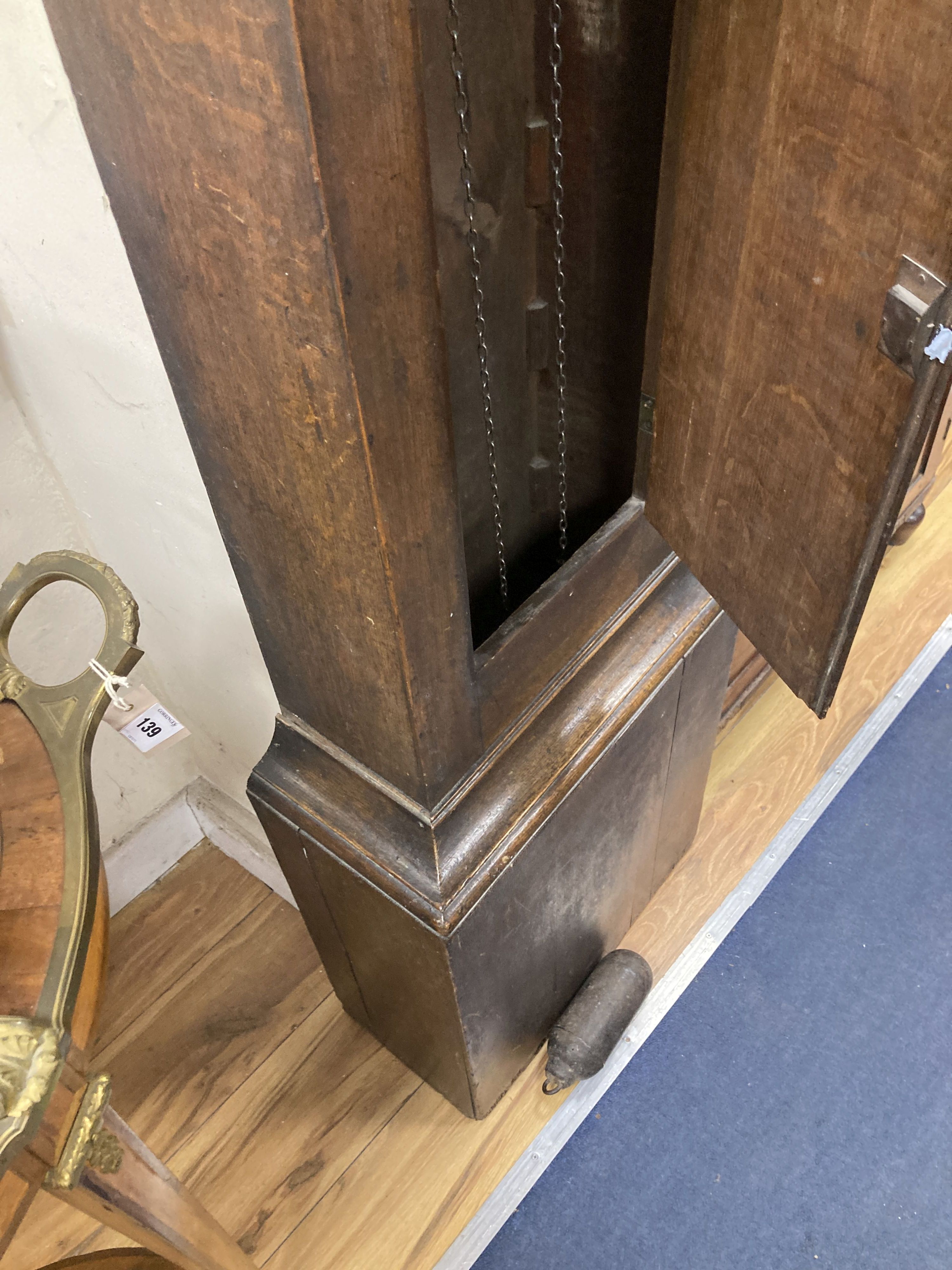 A small 19th century oak cased longcase clock (for restoration) 30 hour grandfather clock, the painted dial named Cha. Haines, Swindon,